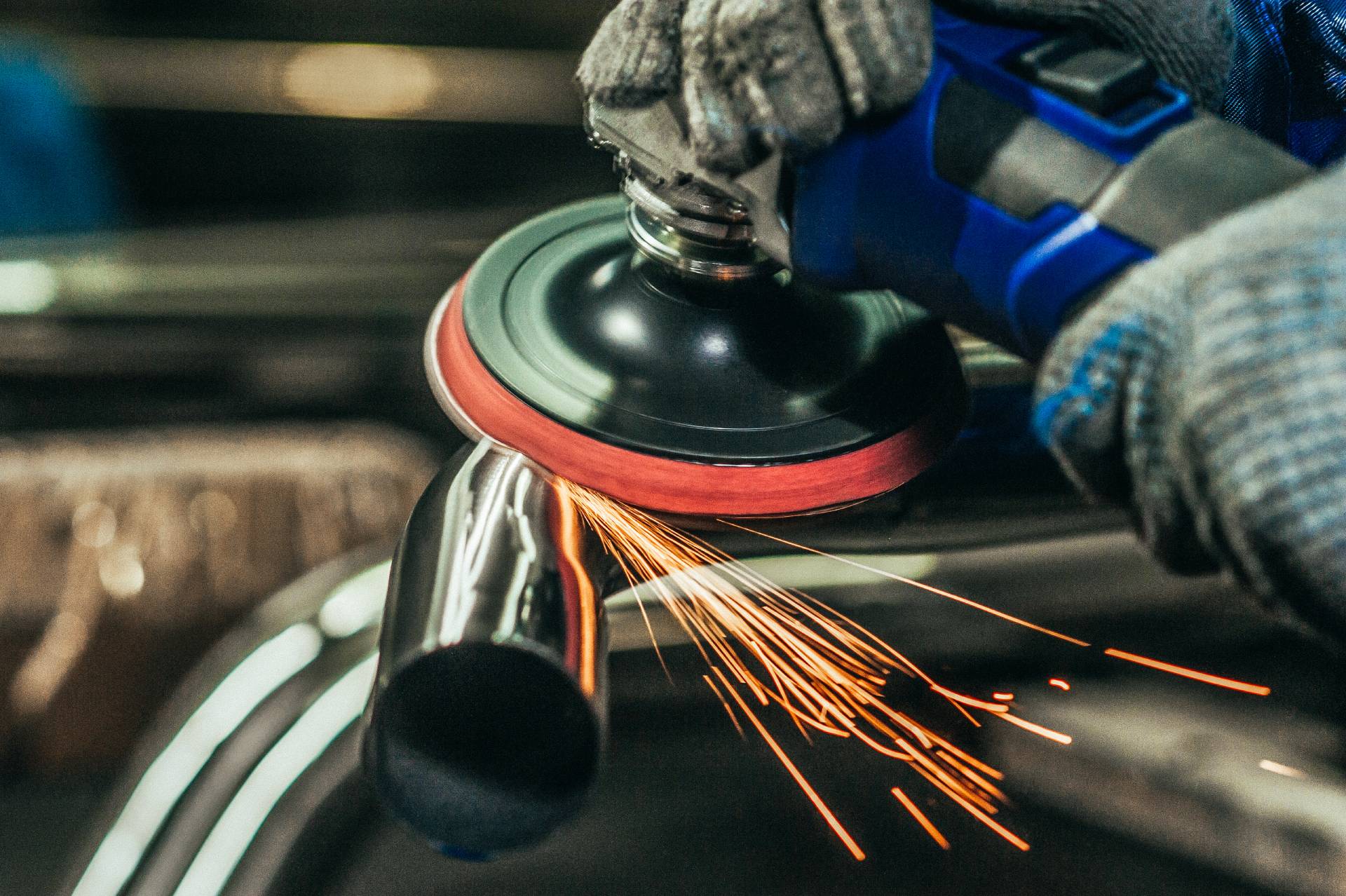 Photograph of a large piece of metal being polished