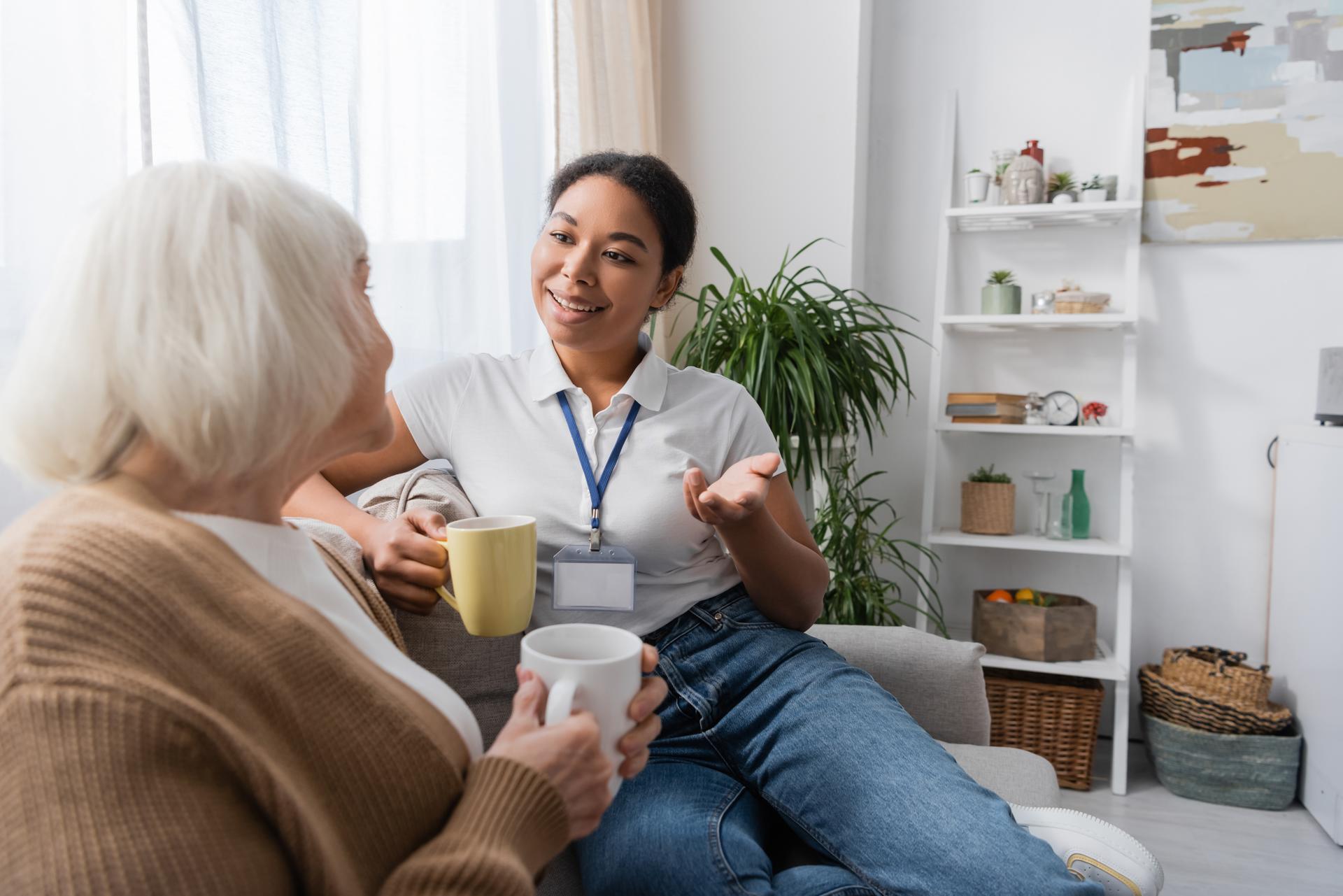 Photograph of a carer speaking to an older lady