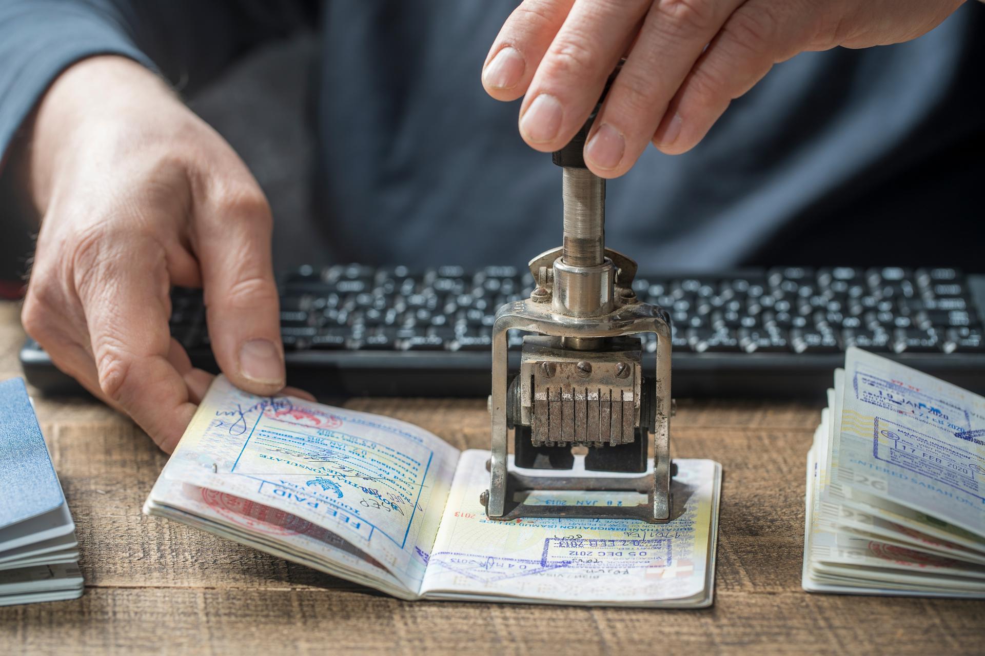 Photograph of a passport being stamped