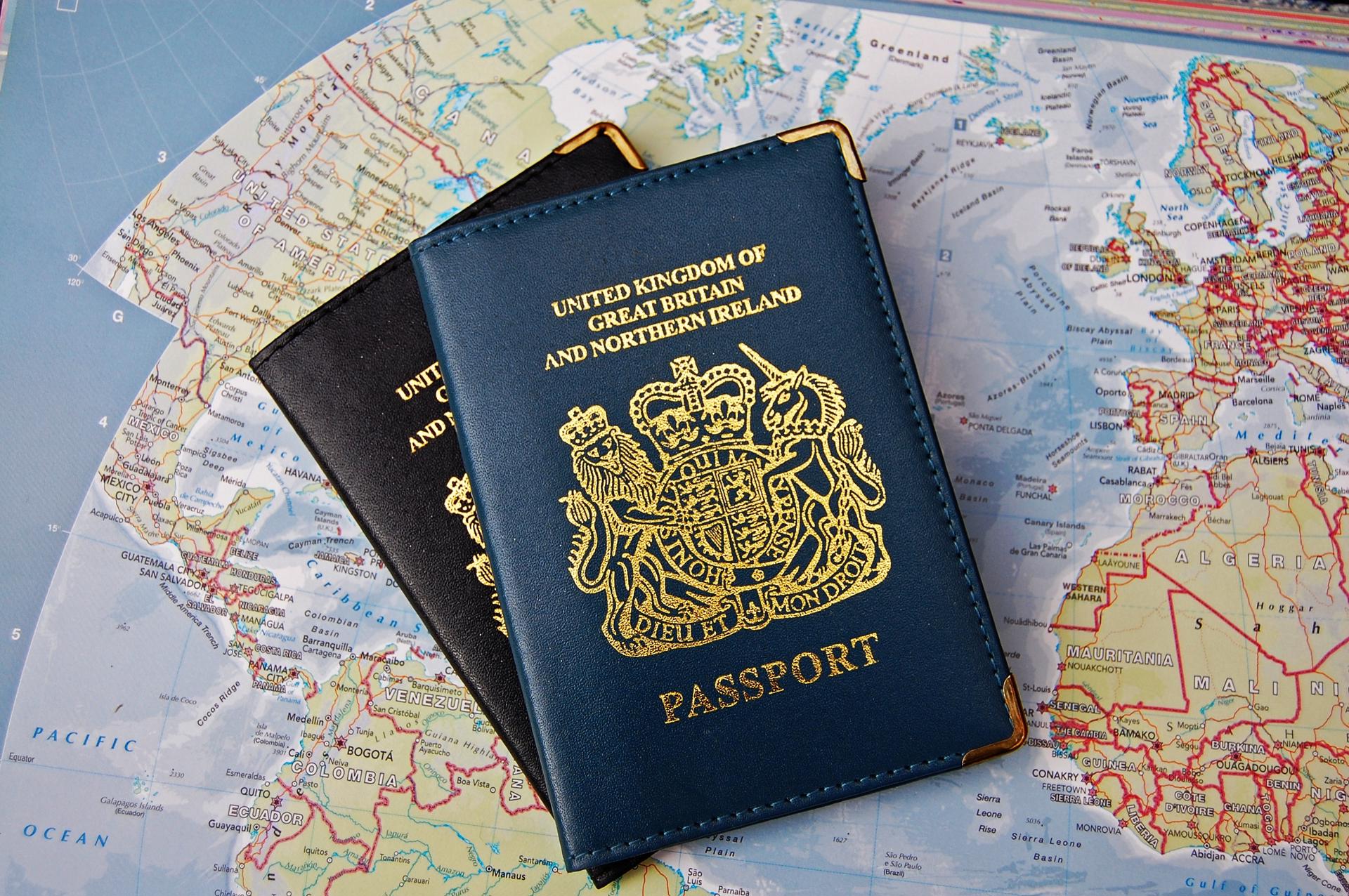 Photograph of a British passport on a map of the world